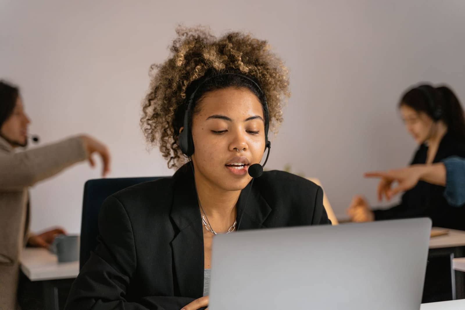 Customer support agent on a headset call assisting a client